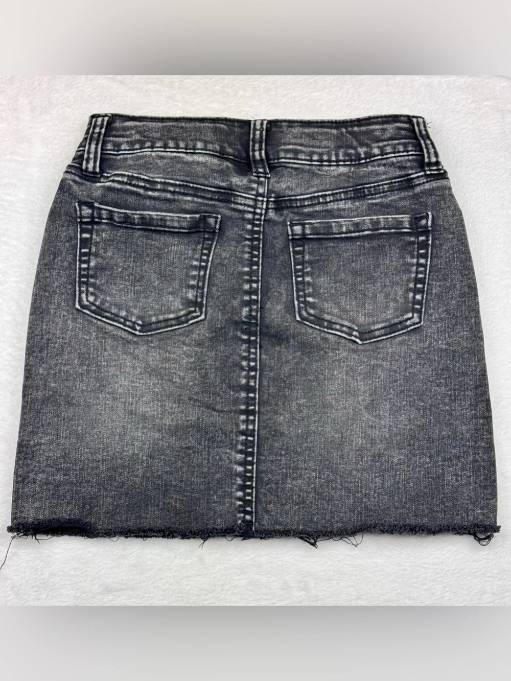 Lot of 2 girls denim skirts. The blue shirt is a size 8, black skirt is size 7/8